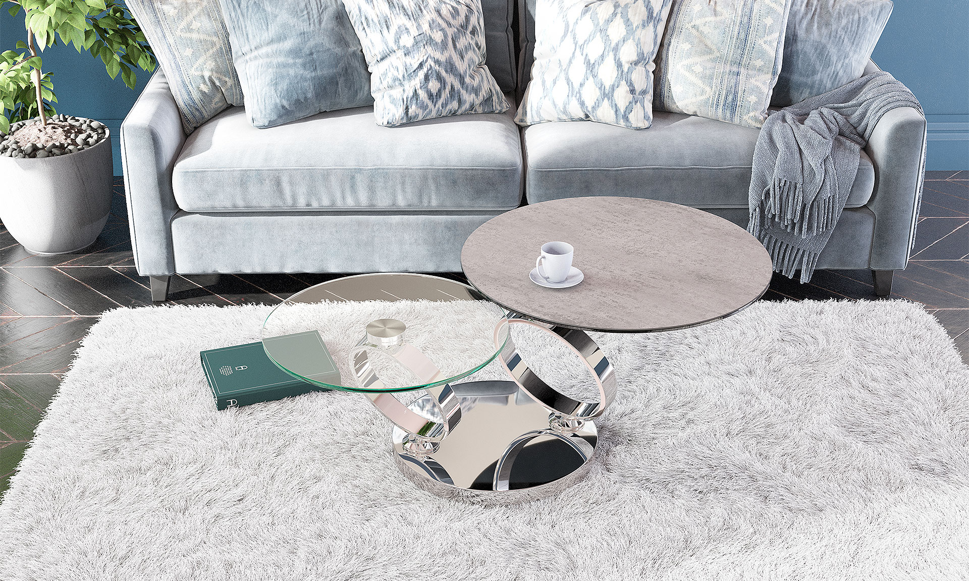 Photo d'ambiance présentant un salon avec une table basse. Les piètement sont en acier chromé avec un plateau en céramique effet béton noir.